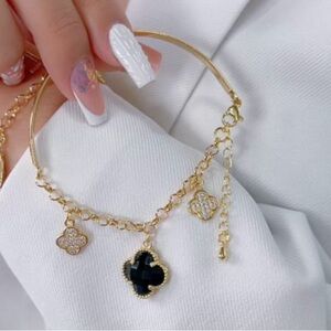 Elegant Gold and Black Charm Bracelet